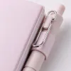 Pink notebook with pen, pink seal, white lace fabric, wooden desktop, silver butterfly, white star pendant Application Scenario